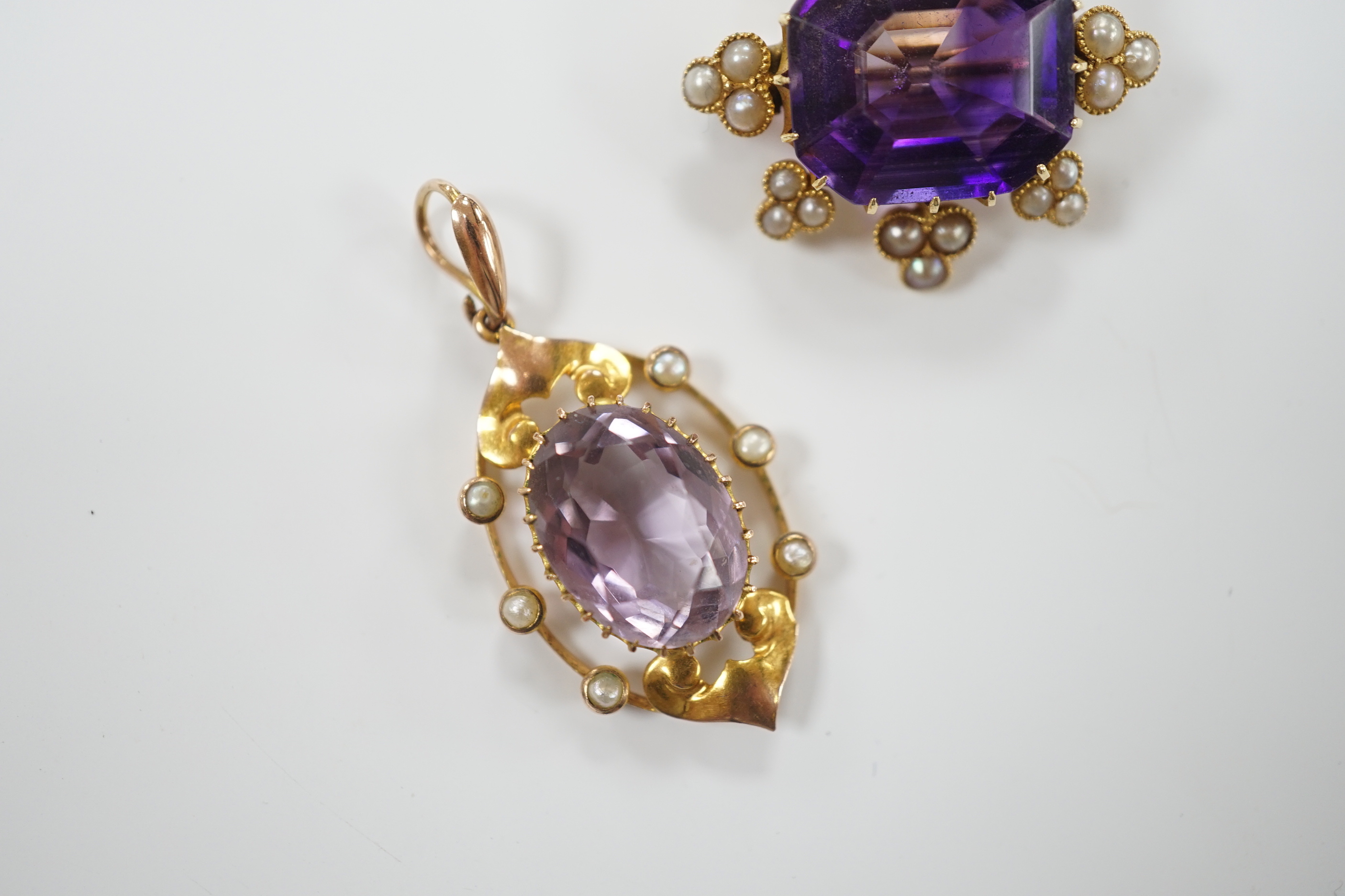 An early 20th century yellow metal, amethyst and seed pearl set brooch, 26mm and a similar pendant, gross weight 9.9 grams.